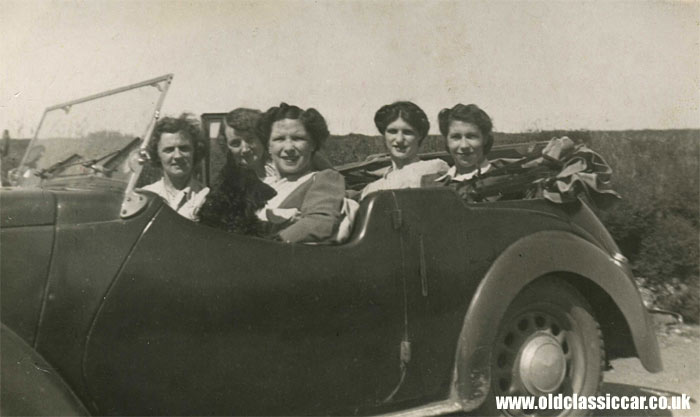 Five ladies sat in their pre-war Austin Eight