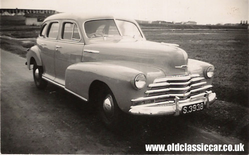 Very nice old photograph that shows a classic Chevrolet sedan