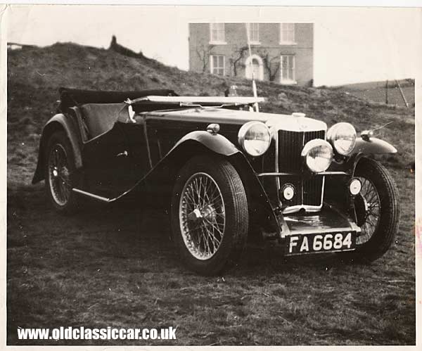 MG TC with old manor house in the background