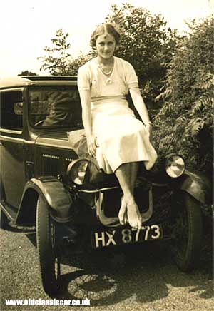 A young lady sat on an Austin 7