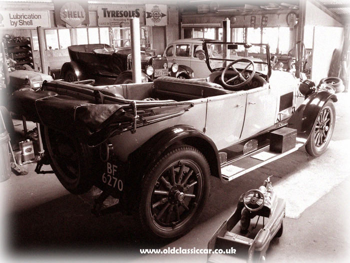 Dodge, Willys-Overland and Hillman Minx in an old garage